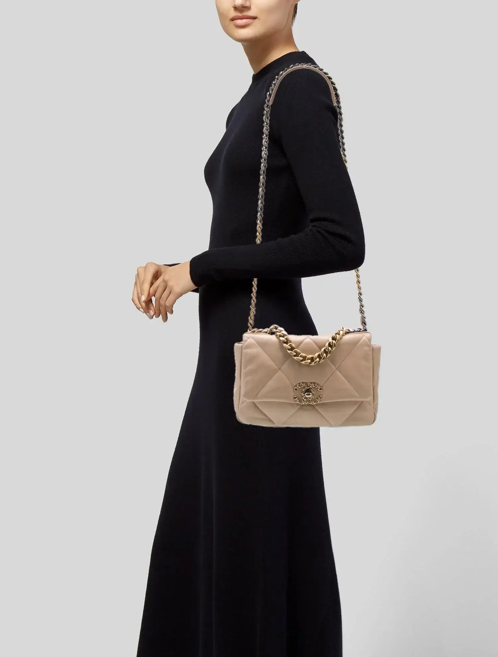 Chanel 19 handbag medium in beige lambskin with gold hardware worn crossbody, perfect luxury bag for women and stylish purse.