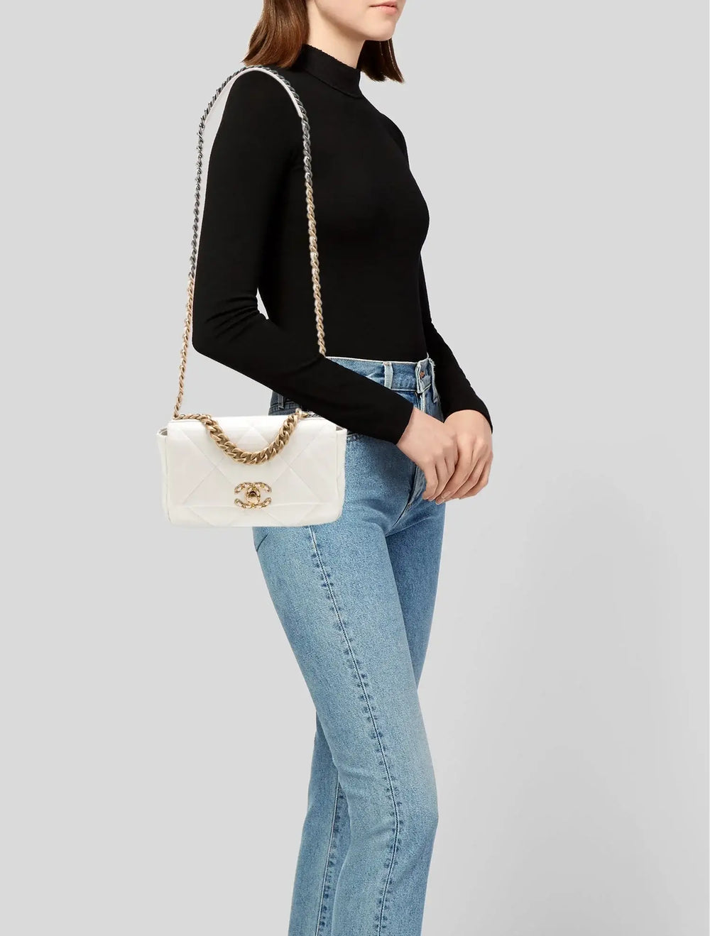 Chanel 19 handbag in white lambskin with gold hardware showcased as an elegant everyday bag for women, perfect gift idea for her.