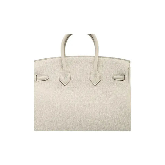 HERMES Birkin Bag in Beton Glacier White togo leather, a luxury bag for women, known for its high quality and timeless style.