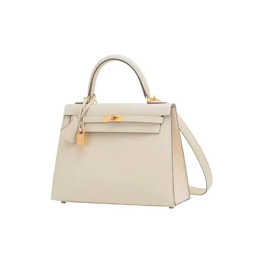 HERMES Kelly 25 Bag in nata white Epsom leather with gold hardware, a luxury bag for women, perfect for elegance and style.