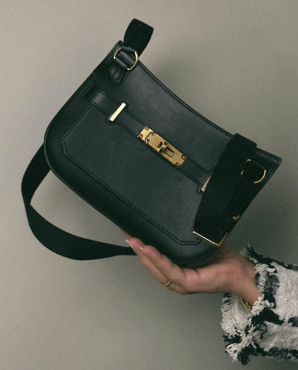 Hermès mini blue indigo Swift Jypsière luxury bag for women, stylish black leather handbag with gold accents.