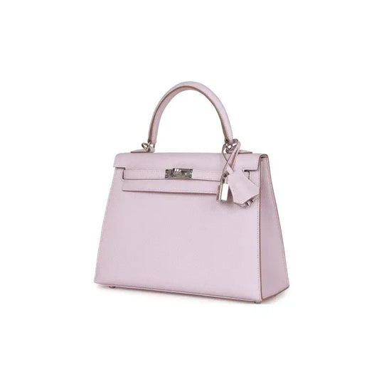 HERMES Kelly Bag in mauve pale dream purple leather, a luxury bag for women with silver hardware, perfect for elegant occasions.