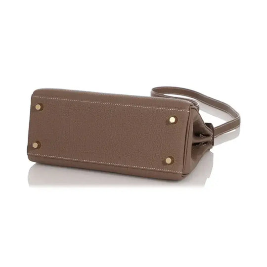 Hermès Kelly elephant gray Togo leather handbag base view, showcasing premium craftsmanship and luxury design.