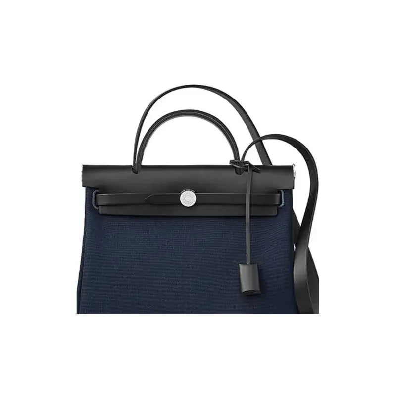 Hermes Herbag 31 navy blue luxury bag for women featuring durable canvas and high-quality calfskin leather, a stylish and functional everyday bag.