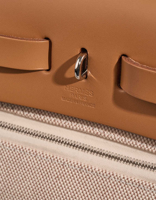 Close-up of Hermès Herbag 31 in Vache Hunter Sable Naturel showcasing high-quality leather and canvas, a chic luxury bag for women.