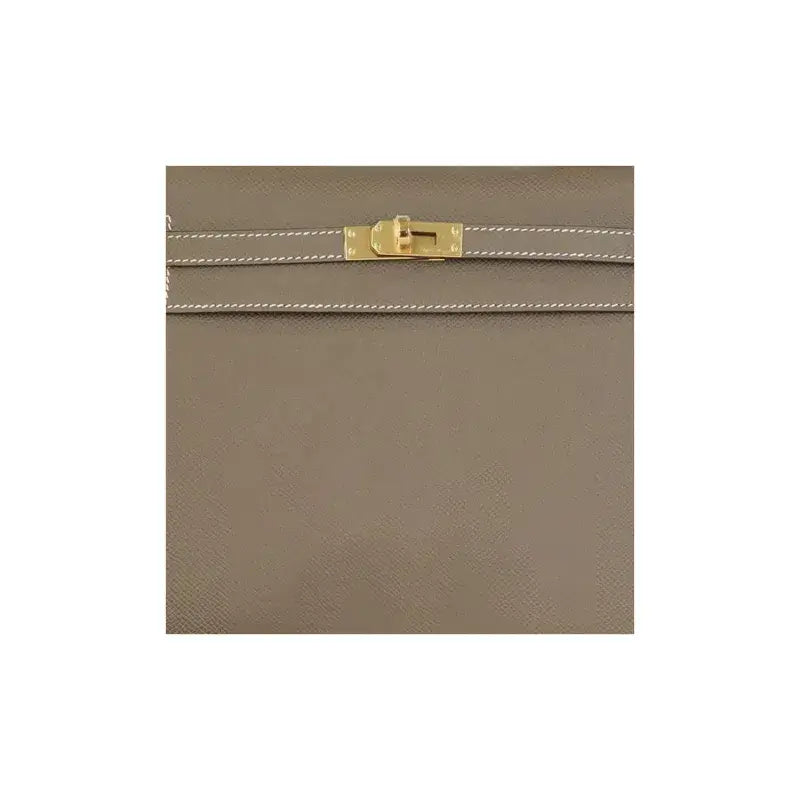 Hermès Kelly Bag in elephant gray with gold hardware, a stylish designer handbag and timeless luxury bag for women.