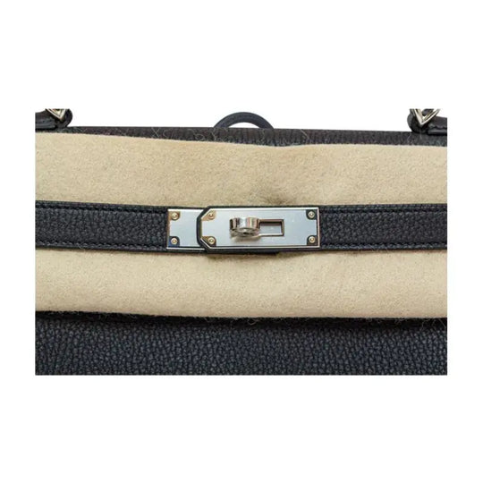 Hermès Kelly 25 navy blue Togo leather luxury bag for women featuring classic silver hardware, perfect as a stylish purse.