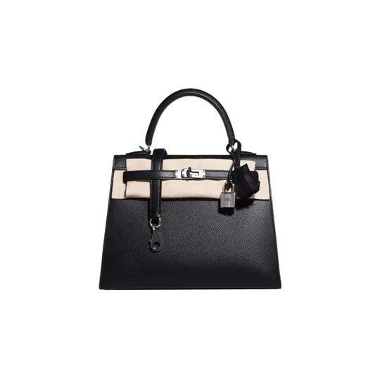 Black luxury handbag with elegant design, crafted from high quality leather, perfect for stylish women, timeless fashion accessory.