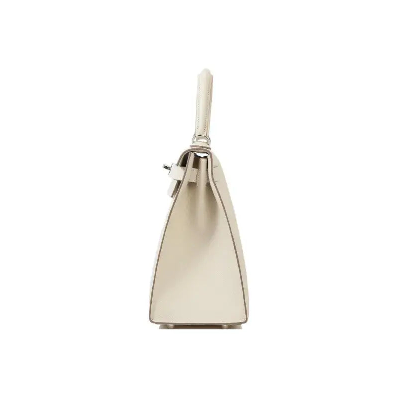 Hermès Kelly 25 handbag in milkshake white Epsom leather showcasing elegant silhouette and high quality craftsmanship.
