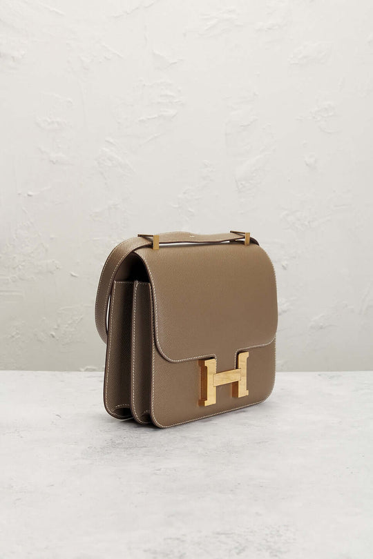 Hermès Constance Mini beige luxury bag for women with gold-tone clasp, a timeless designer handbag perfect for everyday use.