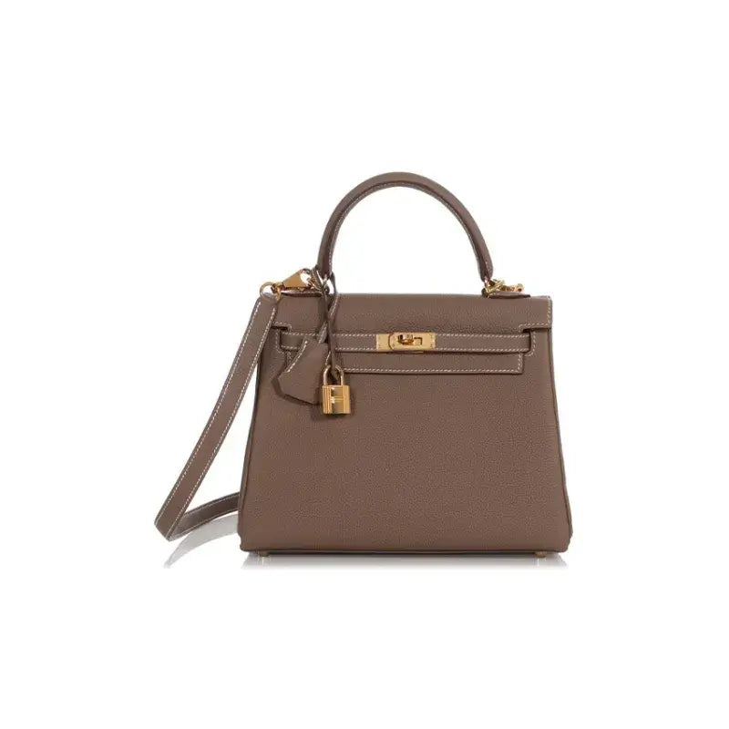 HERMES Kelly brown Togo leather bag for women featuring a stylish design, high quality craftsmanship, and elegant shoulder strap.