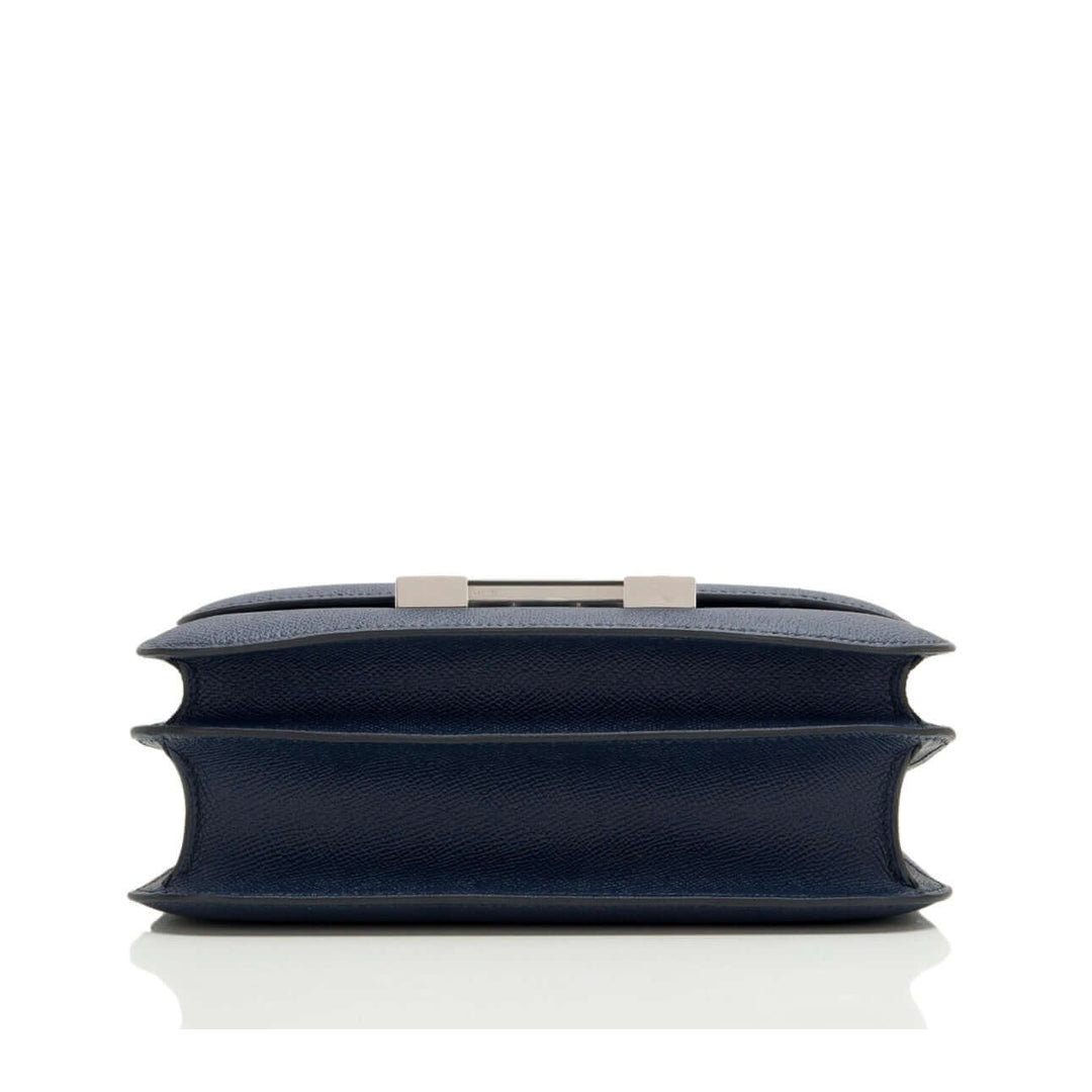 Hermès Constance Mini 18 navy leather handbag with silver-tone clasp, elegant style, luxury bag for women.