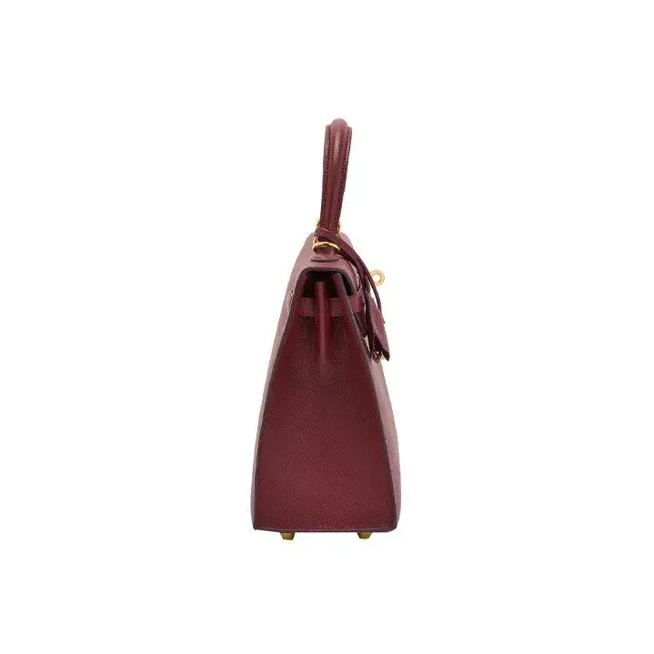 Hermes Kelly red Togo leather handbag showcasing elegant design, gold hardware, and high quality craftsmanship, a luxury bag for women.