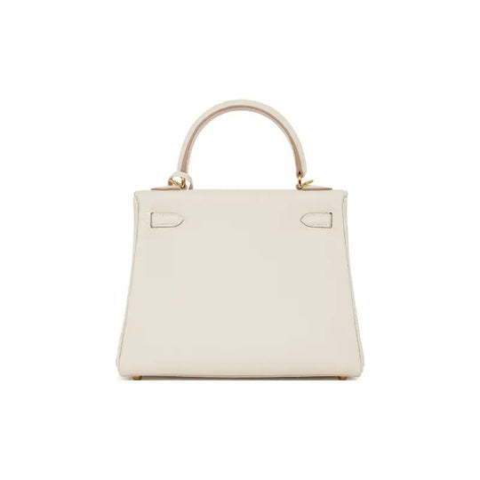 HERMES Kelly 25 cream Togo leather handbag with structured silhouette, an iconic luxury bag for women, ideal for timeless fashion.