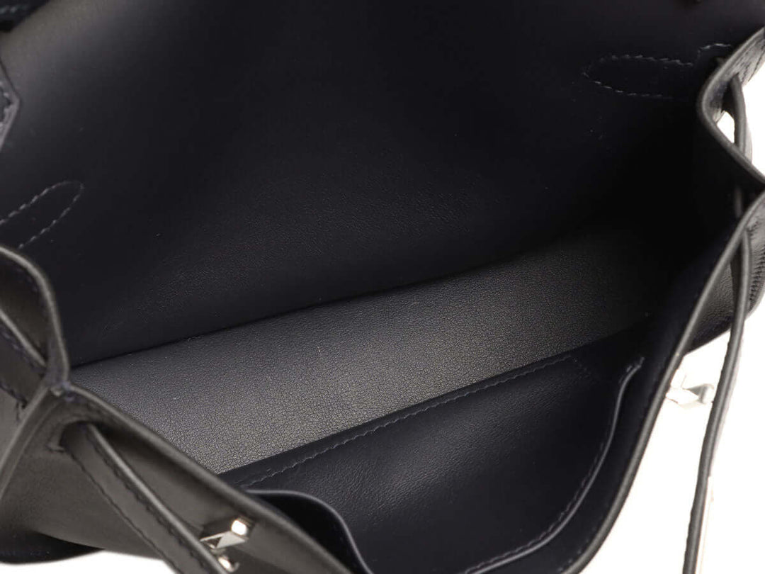 Interior view of Hermès Jypsière luxury bag for women showcasing high quality black leather with ample space for everyday essentials.