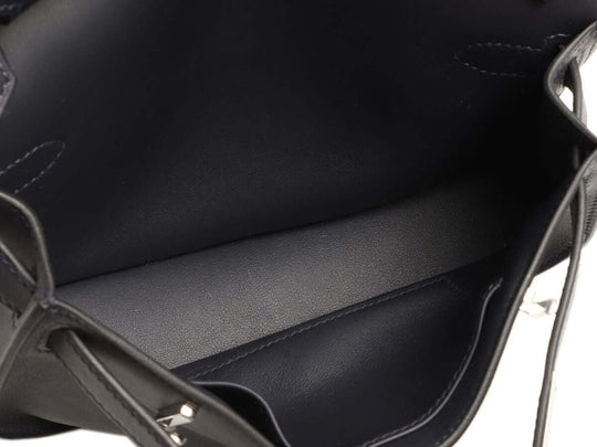 Interior view of Hermès Jypsière luxury bag for women showcasing high quality black leather with ample space for everyday essentials.