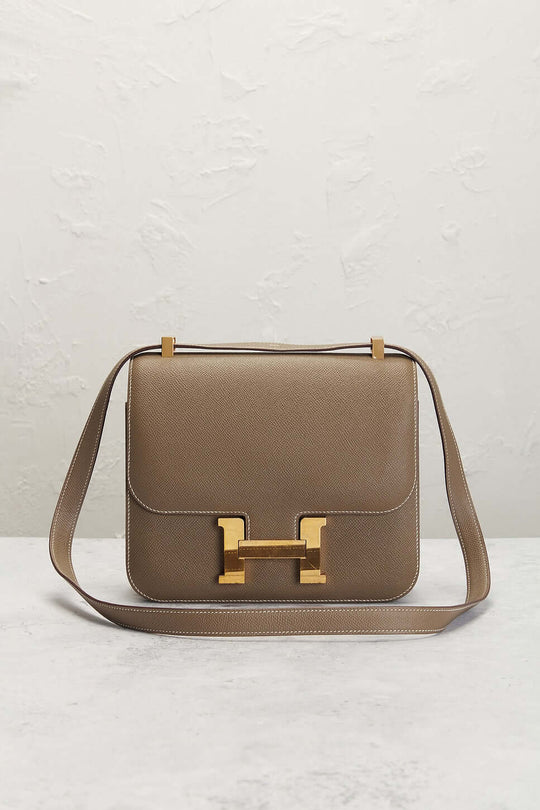 Hermès Constance Mini beige luxury bag for women with structured silhouette and signature H clasp, a timeless fashion accessory.