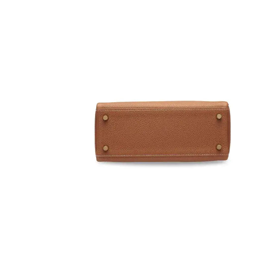 Hermès Kelly 25 brown Togo leather handbag base, a luxury bag for women showcasing high-quality craftsmanship and timeless elegance.