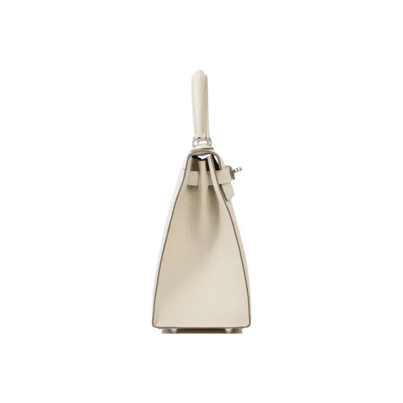 Hermes Kelly 25 bag in milkshake white leather showcasing elegant design and high quality craftsmanship, a perfect luxury bag for women.