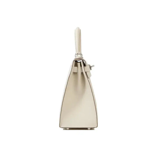 Hermes Kelly 25 bag in milkshake white leather showcasing elegant design and high quality craftsmanship, a perfect luxury bag for women.