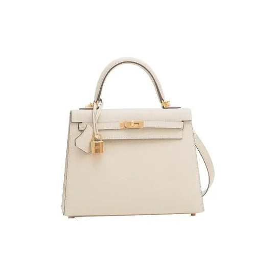 Hermes Kelly 25 handbag in nata white with gold hardware, a luxury bag for women showcasing timeless elegance and high quality.