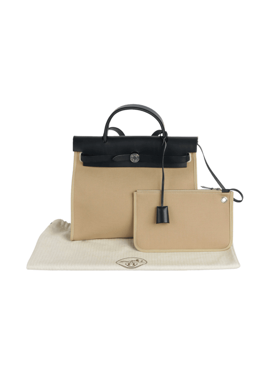Hermes Herbag 31 beige luxury bag for women with black leather accents, stylish and functional everyday bag.