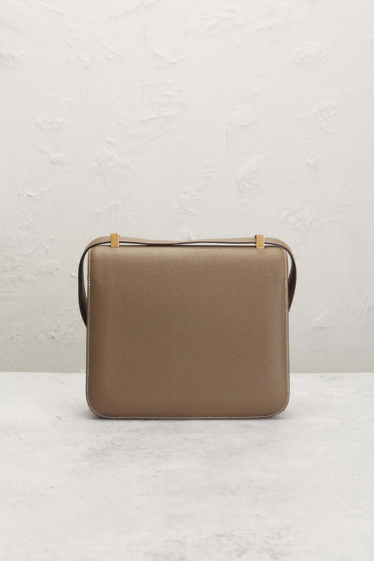 Hermès Constance Mini beige luxury bag for women featuring structured silhouette and signature clasp, a timeless fashion bag.