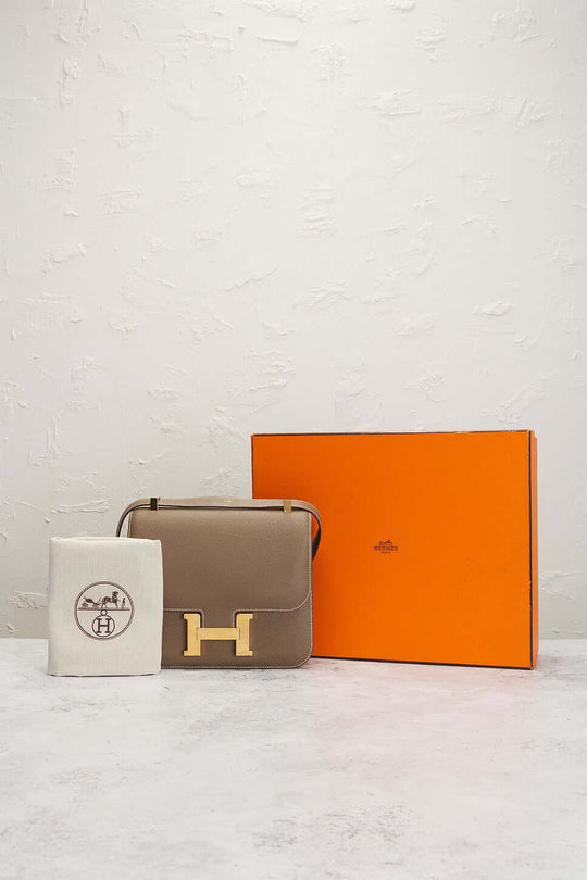 Hermès Constance Mini beige luxury bag for women with gold clasp and orange box, a timeless designer handbag