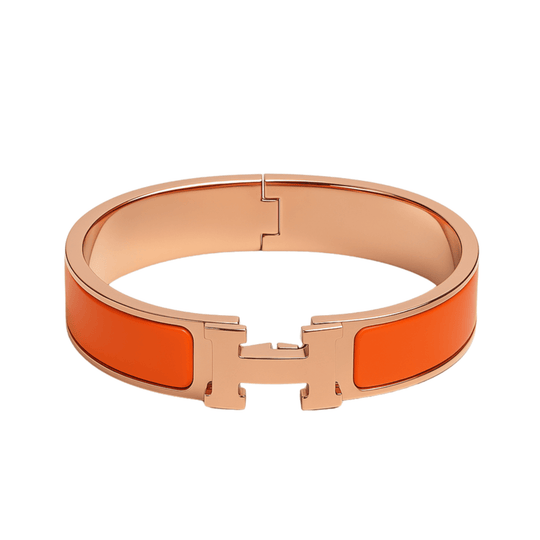 Hermes Clic HH bracelet in 12MM orange featuring a signature H clasp in VGold, a high quality timeless fashion accessory.