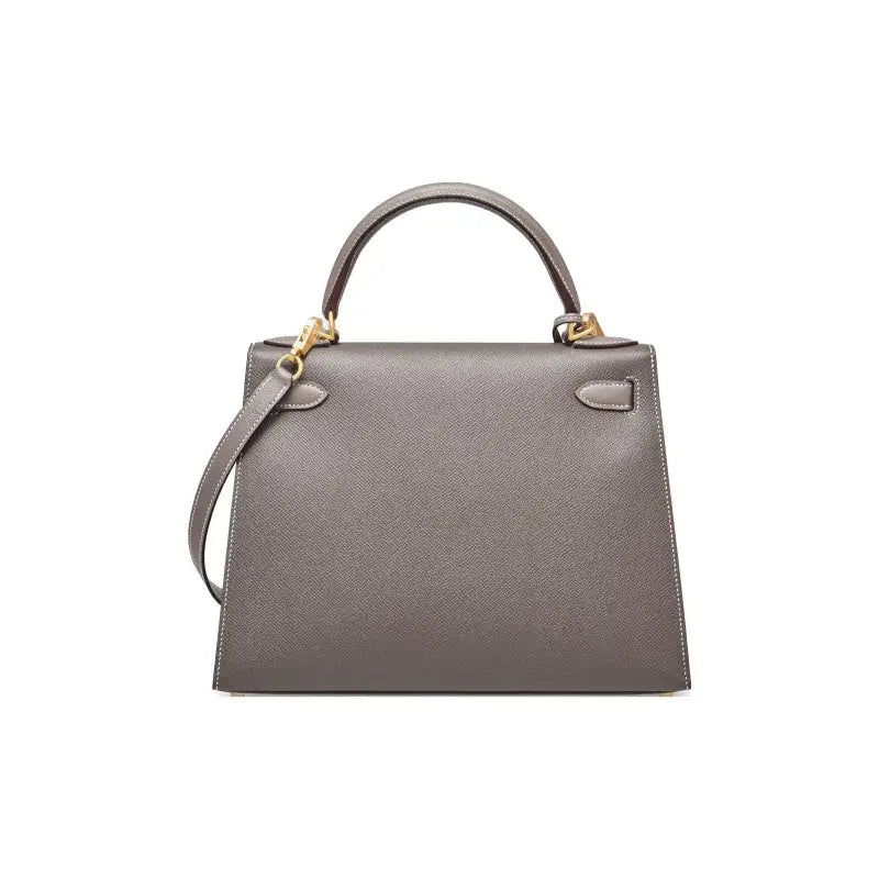 HERMES Kelly Bag in tin gray Epsom leather with gold hardware, a luxury bag for women and a timeless fashion statement.