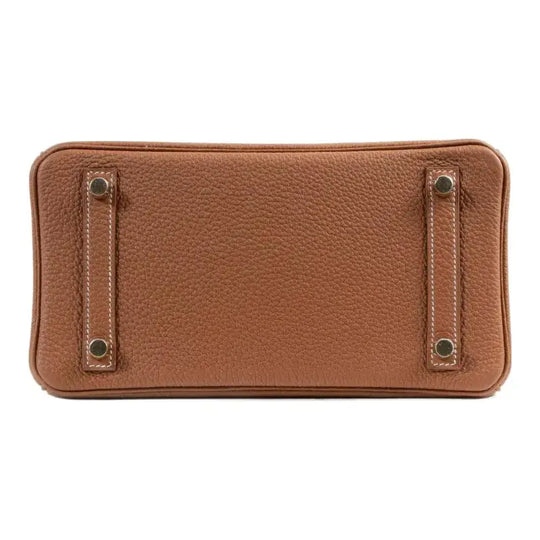 Hermes Birkin 25 brown togo leather handbag base with metal feet, a luxury bag for women known for its craftsmanship and style.