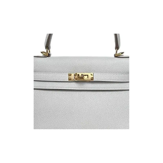 HERMES Kelly 25 cream gray Togo leather handbag with gold hardware, a stylish designer handbag ideal for women, high quality fashion accessory.