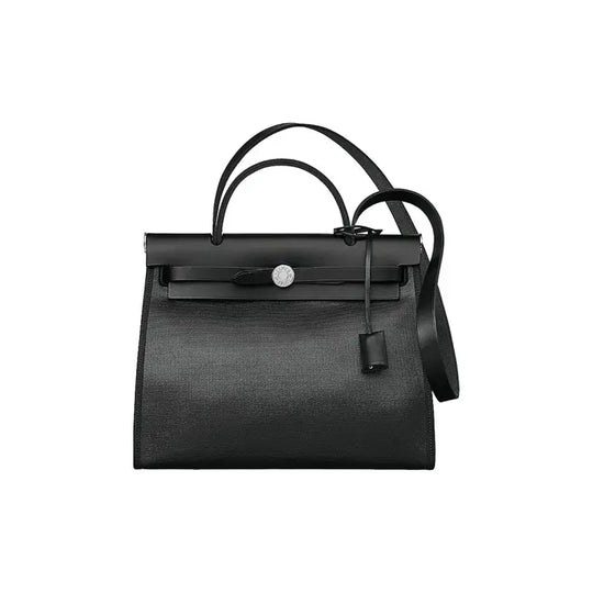 Hermès Herbag 39 shiny black luxury bag for women featuring durable canvas and calfskin leather, a stylish everyday bag.