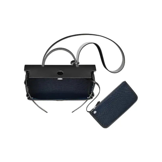 Hermes Herbag 31 navy blue luxury bag for women with detachable pouch, designed for everyday elegance and high quality fashion accessory.