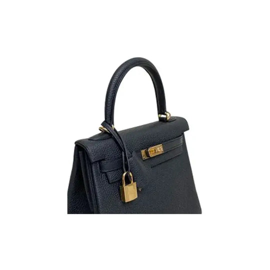 HERMES Kelly 25 black Togo leather designer handbag with gold hardware, elegant luxury bag for women.