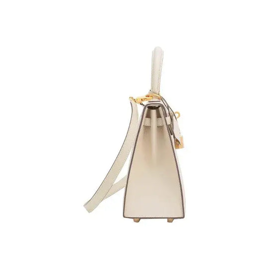 HERMES Kelly 25 luxury bag for women in nata white with gold hardware, showcasing elegant craftsmanship and timeless design.