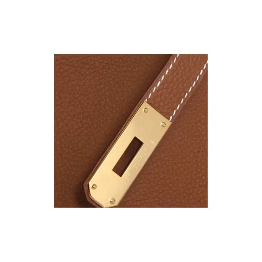 Hermès Birkin 25 Bag brown togo leather strap with gold hardware, a timeless luxury bag for women and a high-quality fashion accessory.