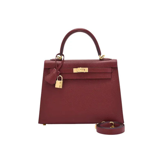 HERMES Kelly red Togo leather handbag with gold hardware, an elegant luxury bag for women and a timeless fashion accessory.