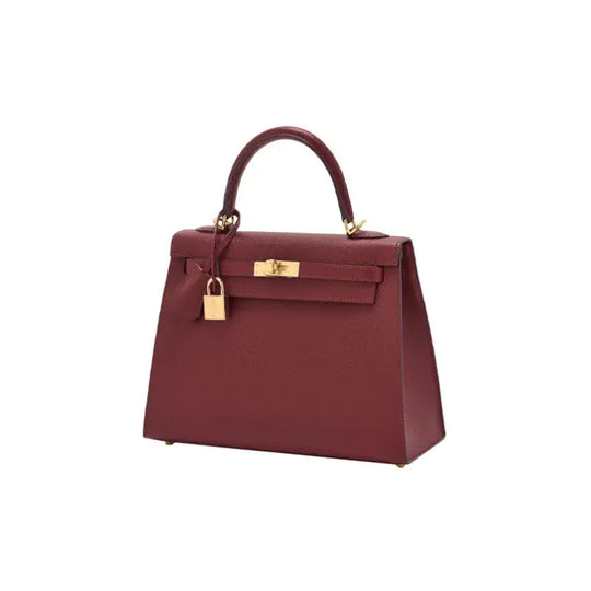 HERMES Kelly red Togo leather handbag with gold hardware, a luxury bag perfect for women seeking timeless elegance.