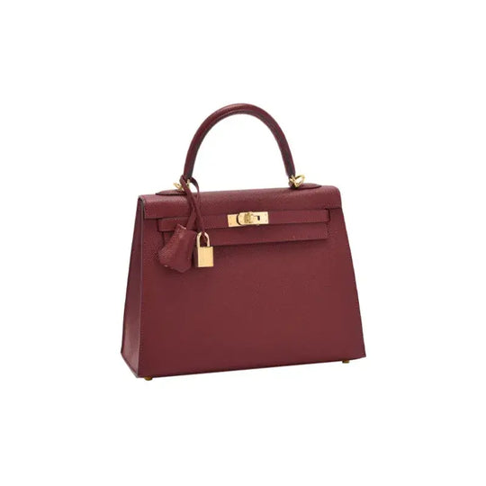 HERMES Kelly red Togo leather handbag with gold hardware a luxury bag for women and a timeless fashion accessory